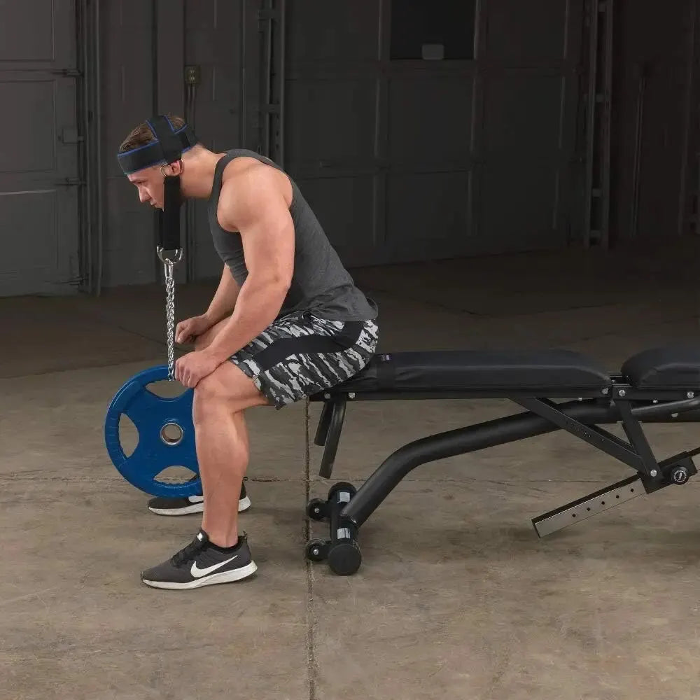 Man performing a seated strength exercise with a JB Muscle™ Ultimate Neck Trainer as a targeted exercise for neck strength.