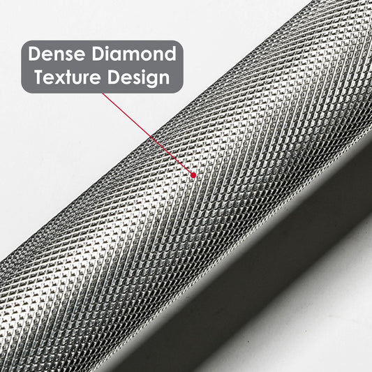 Close-up of the JB Muscle Olympic Barbell Bar (2 inch) showing its dense diamond texture design, highlighted by a red arrow pointing to the grip surface.
